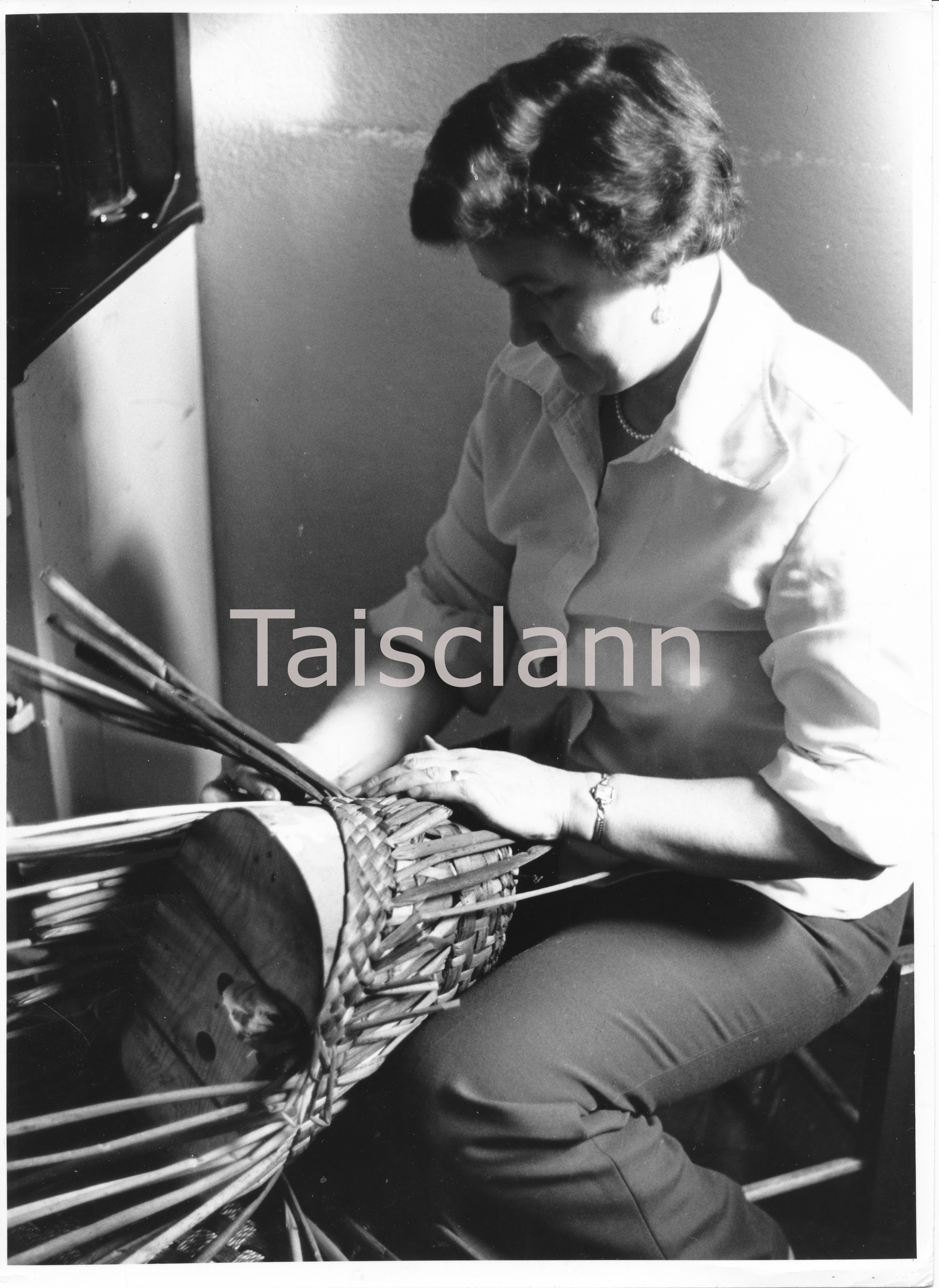 Mrs. Frances Brennan of the Slieve Bawn Co-operative of Roscommon making a rush basket.