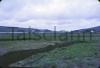 Turf bog near Meenacuing, Gweedore. Turf burning station in background.