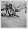 Lifting the Dolphin onto the trolley.