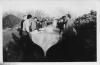 Men lift a boat in Burtonport.