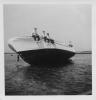 Men up on the big boat.