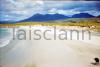 Beach with Maumturk Mountains, Galway in the distance.