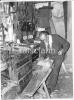 John Surlis of Monasterredan working on his grey mare using a draw knife to shape a chair leg.