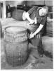 A cooper repairing a barrel at Old Bushmills.